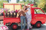 Tonneli Gruetter, left, and Kim Gruetter of Salty Acres Whidbey Island Flower Farm had vase holders welded onto their firetruck, "Salty."