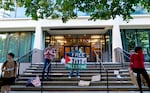 A small group of Portland State University students, alums, and supporters stand on the PSU Administration building steps, Oct. 7, 2024, marking the one year since the Hamas attack on Israel.