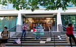 A small group of Portland State University students, alums, and supporters stand on the PSU Administration building steps, Oct. 7, 2024, marking the one year since the Hamas attack on Israel. 