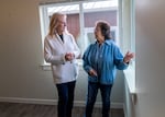 Grand Ronde Tribal Council member Denise Harvey, left, and future resident Marcela Selwyn tour one of 24 new homes constructed by the Confederated Tribes of Grand Ronde on Dec. 11, 2023, in Grand Ronde. Selwyn has lived in the community for 17 years and will be moving into one of these climate resilient single-family homes in early 2024.