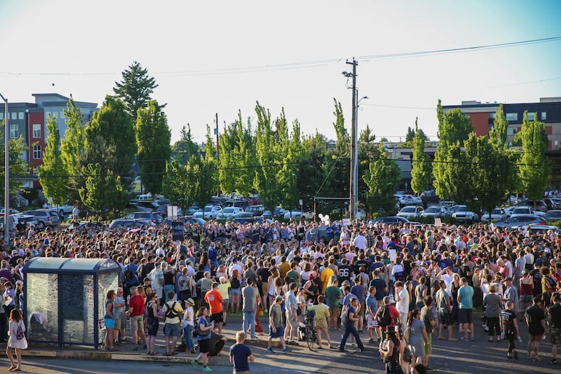 The crowd filled the platform of the Hollywood Transit Center, a daily stop for hundreds of Portland commuters.