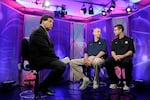 FILE - Greg Gumbel, left, watches as Connecticut head coach Jim Calhoun talks to Butler head coach Brad Stevens, right, prior to taping a television interview for the men's NCAA Final Four college basketball championship game on April 3, 2011, in Houston.