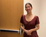 Abigail Figueroa opening a door leading to the wings of the Westview High School theatre during a "Frozen" rehearsal.