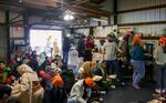 People eat food prepared at the langar, which sits inside what used to be a garage and gets very crowded on Sundays.