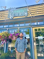 Joe Kiefer-Lucas is co-owner of Bar Purlieu, a French bistro located at 1530 Willamette St. in Eugene. He's pictured here on July 23, 2026, one week after the restaurant's outdoor dining structure was damaged for the third time by a vehicle crash.