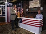 Dixville Notch Town moderator Tom Tillotson checks his watch just before midnight voting at the Hale House at the Balsams Resort in 2020.