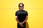 The Metals Company CEO Gerard Barron poses for photographs against a yellow background in New York City on June 5, 2025. 