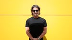 The Metals Company CEO Gerard Barron poses for photographs against a yellow background in New York City on June 5, 2025.