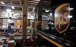 FILE - A worker loads packages at the United Parcel Service facility on Tuesday, Feb. 1, 2011 in Williston, Vt. Layoffs announced in February 2024 in North Portland are part of a national cost-cutting effort by the company. 