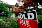 A sold sign stands outside a home in Wyndmoor, Pa., on June 22, 2022. Two recent studies suggest that prospective homeowners will have to earn more than $100,000 annually to afford a typical home in much of the U.S.