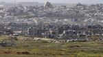 A view over ruined buildings in the northern Gaza Strip as seen from a position on the Israeli side of the border on April 2, southern Israel. Defense Minister Israel Katz has said Israel will "capture extensive territory" to be added to "buffer zones" in the Gaza Strip after the military expanded its ground assault.