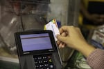 A person swipes an EBT card at a cash register in an undated photo provided by the U.S. Department of Agriculture.