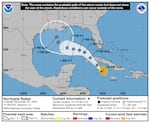 The National Hurricane Center says Rafael has strengthened into a hurricane as it approaches the Cayman Islands. The storm will move across Cuba and enter the Gulf of Mexico as a hurricane.