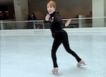 Billie McBride-O'Nell in all black looks at the camera
