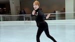 Billie McBride-O'Nell in all black looks at the camera