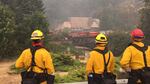 Firefighters survey efforts to save the Historic Multnomah Falls Lodge Tuesday, Sept. 5, 2017. Crews successfully saved the lodge from the Eagle Creek Fire after an all-day effort Tuesday.
