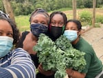 Shantae Johnson (left) snaps a selfie with the farm crew at Mudbone Grown's Feed 'Em Freedom Farm
