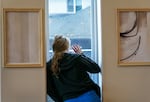 Unable to have visitors, Aleah, 23, can only wave to her boyfriend while detoxing at Recovery Works NW, near Portland, Ore., Dec. 15, 2023. Aleah had been at the facility for five days. Recovery Works is a medication-assisted treatment program, focusing on opiod dependency, that opened a new detox facility last fall, funded by Measure 110. OPB is only identifying Aleah by her first name, because of the stigma attached to addiction.