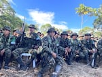 Rebels from the Comandos de la Frontera stand in formation in the jungle, waiting to disarm and hand over their weapons during a rare demobilization ceremony in southern Colombia.