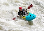 To’nehwan Jayden Dauz from the Hoopa Valley Tribe, 15, braces himself in a rapid on the Klamath River near where the Copco 1 and 2 dams once stood, June 22, 2025.  Dauz is a participant in Paddle Tribal Waters, a program that trained Indigenous youth for several years to be the first group of people to paddle the free-flowing Klamath from source to sea.