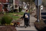 A person walks through a housing development in Battle Ground, Wash., on Feb. 10, 2026.