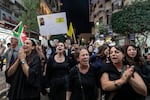 Demonstrators chant slogans while marching in a protest in the city of Ramallah in the occupied West Bank on Saturday, after Hezbollah confirmed reports of the killing of its leader Hassan Nasrallah in an Israeli airstrike.