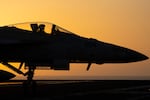 A fighter jet maneuvers on the deck of the USS Dwight D. Eisenhower in the Red Sea, June 11, 2024.