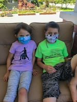 Maggie Anderson, 6, and Orrin Anderson, 6, with their themed masks. Summer programming in the Baker School District will be in-person, and masks are encouraged.