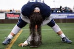 Lake Oswego's Niko Smith stretches after halftime of the Oregon 6A football championship at Hillsboro Stadium in Hillsboro, Ore., Saturday, Dec. 7, 2019. Central Catholic defeated Lake Oswego 49-28.