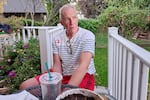 Nathaniel Stringer’s uncle, Matt Stringer, sits on his back porch in Ontario, Ore., on Oct. 13, 2022. A retired music marketing executive, Stringer returned to Malheur County from New York to care for his mother when she was ill. 