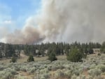 Smoke billows from the Crooked River National Grassland in southern Jefferson County, Oregon.