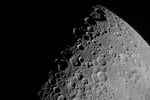 art002e009281 (April 6, 2026) – The Artemis II crew captures a portion of the Moon coming into view along the terminator – the boundary between lunar day and night – where low-angle sunlight casts long, dramatic shadows across the surface. This grazing light accentuates the Moon’s rugged topography, revealing craters, ridges, and basin structures in striking detail. Features along the terminator such as Jule Crater, Birkhoff Crater, Stebbins Crater, and surrounding highlands stand out. From this perspective, the interplay of light and shadow highlights the complexity of the lunar surface in ways not visible under full illumination. The image was captured about three hours into the crew’s lunar observation period, as they flew around the far side of the Moon on the sixth day of the mission.