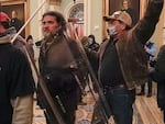 In this Jan. 6, 2021, photo, rioters, including Dominic Pezzola, with a police shield, are confronted by U.S. Capitol Police officers outside the Senate chamber inside the Capitol on Jan. 6, 2021.