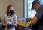 Zoë Diskin, left, gets help from her father Todd as she moves into her dorm in Corvallis, Ore., at Oregon State University, Sept. 20, 2021.