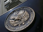 FILE - A seal is displayed on the front of the Veterans Affairs Department building in Washington on June 21, 2013. The U.S. Defense Department and the Department of Veteran Affairs are making it difficult, and sometimes impossible for veterans to get infertility treatments, according to lawsuits filed Wednesday, Aug. 2, 2023, in federal courts in New York and Boston. (AP Photo/Charles Dharapak, File)