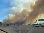 Smoke from nearby wildfires fills the sky are Jefferson Public Radio reporter April Ehrlich drives for the Interstate 5 on-ramp in Phoenix, Ore., on Tuesday, Sept. 8, 2020. Thousands of Oregonians have been forced to flee their homes as wildfires kicked up by dry, windy conditions swell across the state.