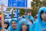 Despite the pouring rain, hundreds of people attended Portland Association of Teachers rally held at Roosevelt High School in Portland, Ore., Nov. 1, 2023. 