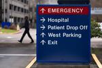 FILE - A person walks past a sign directing vehicles toward the emergency room at Providence St. Vincent Medical Center on Thursday, Feb. 6, 2025, in Portland, Ore.