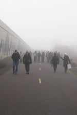 Protestors walk to their vehicles after a demonstration at Medford's Immigration and Customs Enforcement office on Jan. 13, 2026.