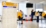 People vote in Norwalk, Calif., during early voting in California's primary election on June 1, 2026. The Department of Justice has charged 28 green card holders in the state for allegedly illegally registering to vote or voting in U.S. elections, in an escalation of a feud with California officials over the state’s voting system.