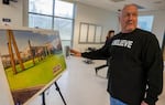 Alan Evans shows off a rendering of his vision for Wapato Jail. 