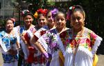 Dancers from Grupo Lol-bé pose for a photo after performing Mexican cultural dances. 