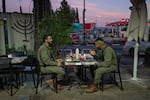 Soldiers eat dinner at a restaurant in Kiryat Shmona, Israel, on Jan. 7. Kiryat Shmona, located approximately a mile from the border with Lebanon, was evacuated as hostilities with Hezbollah escalated following the Oct. 7 attacks.