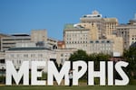 A woman takes a selfie in front of the Memphis, Tenn., skyline on Sept. 29.