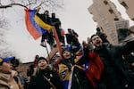 Anti-Maduro demonstrators fly Venezuelan flags outside the federal courthouse in Lower Manhattan, New York, on Monday, January 5.