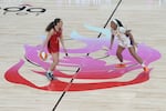 FILE - Portland Fire guard Carla Leite, left, drives the ball down court past Los Angeles Sparks Chance Gray during the first half of a WNBA preseason basketball game against the Los Angeles Sparks, Sunday, May 3, 2026, in Portland, Oregon.