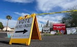 A sign points voters in the right direction to drop off ballots in Phoenix on Nov. 7, 2022.