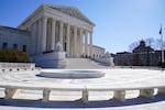 The exterior of the Supreme Court building on a sunny day.