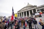 In this Wednesday, Jan. 6, 2021 file photo, Donald Trump supporters gather outside the Capitol in Washington.