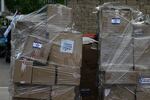 Boxes of donated supplies. The sign says, "With love from the residents of Herzliya."